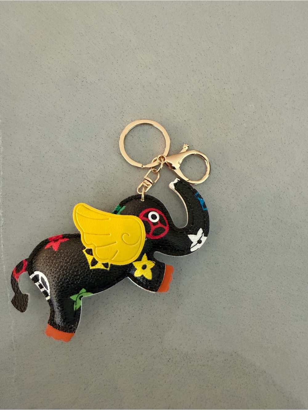 Black Elephant Wing Keychain Pet Toy Charm - Yellow Accent